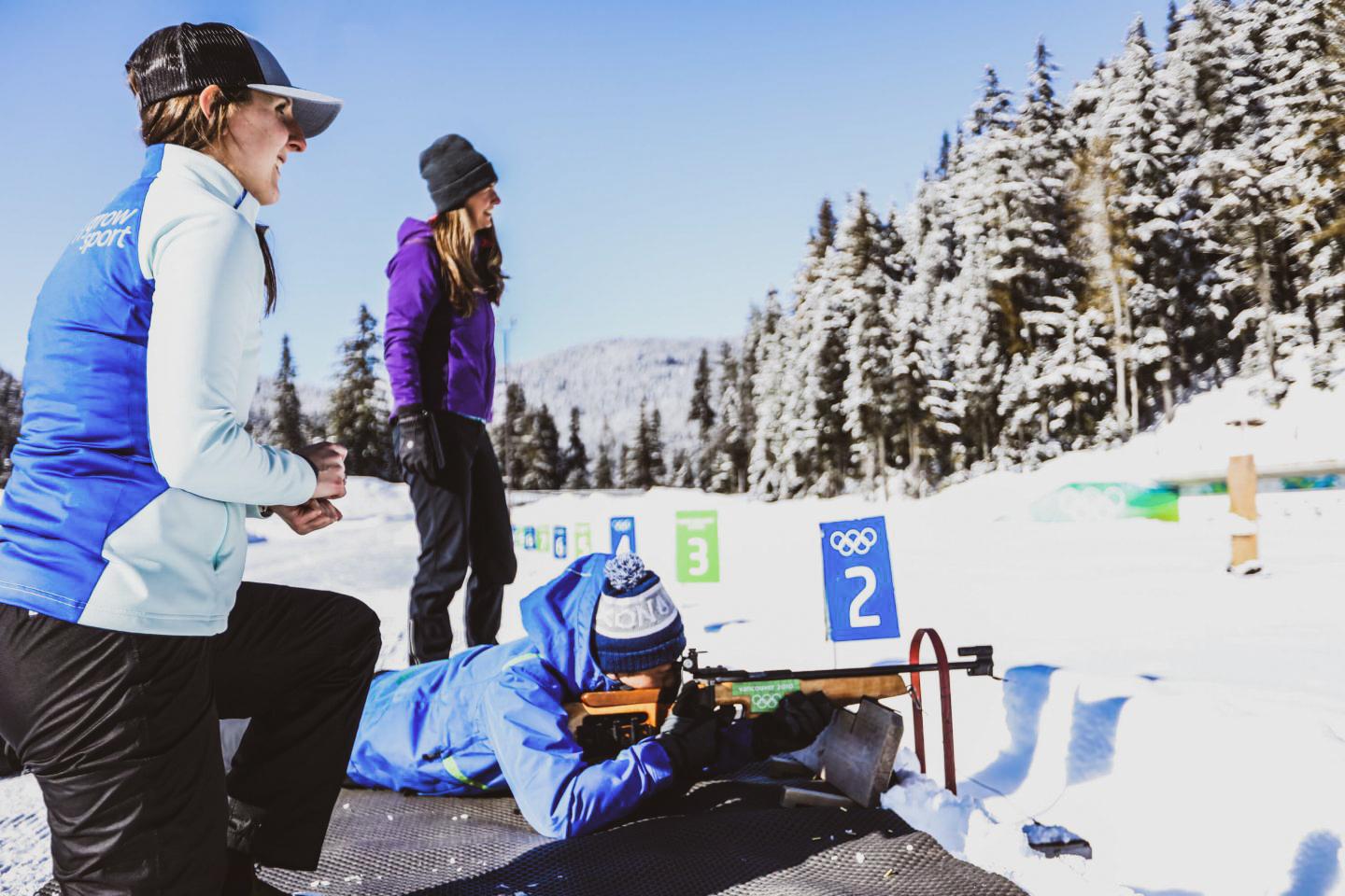 sport shooting in winter; three participants